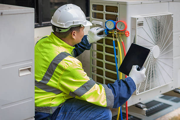 Professional Heat Pump Repair technician working in Commiskey, IN